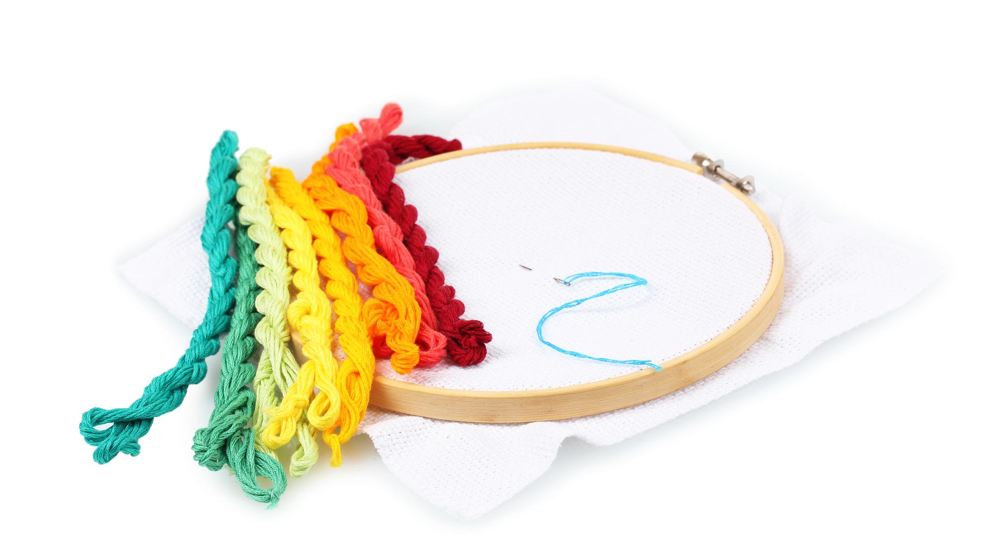 Teacher demonstrating embroidery technique